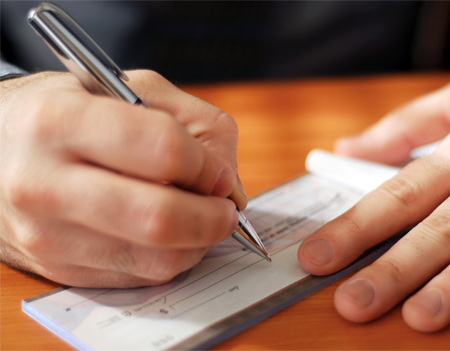 Man Writing a Check Man Writing a Check